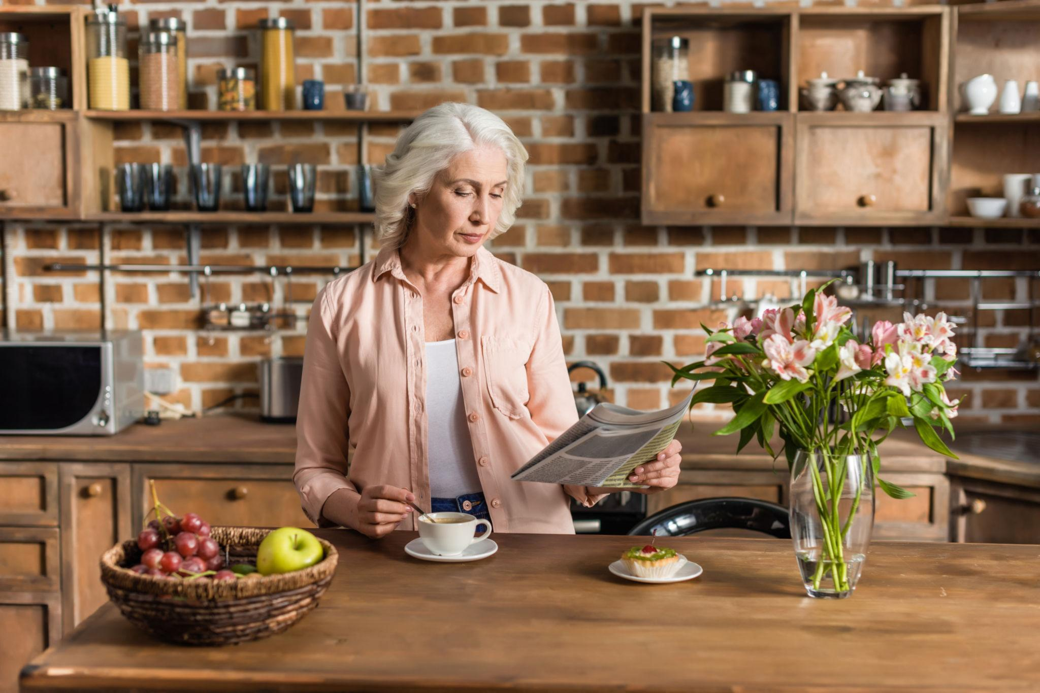 An older woman enjoying her morning routine at home